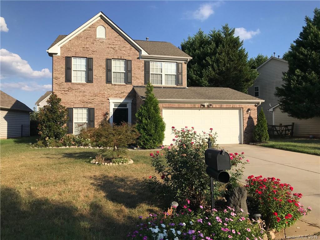 609 Eaton Court Fort Mill, SC 29708 - Photo 1 of 24 a front view of a house with a yard