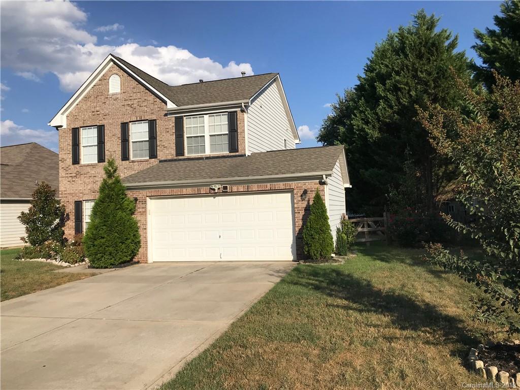 609 Eaton Court Fort Mill, SC 29708 - Photo 2 of 24 a front view of a house with a yard and garage