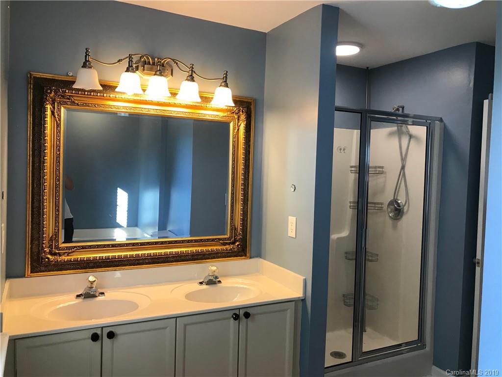 609 Eaton Court Fort Mill, SC 29708 - Photo 18 of 24 a bathroom with a sink and a mirror