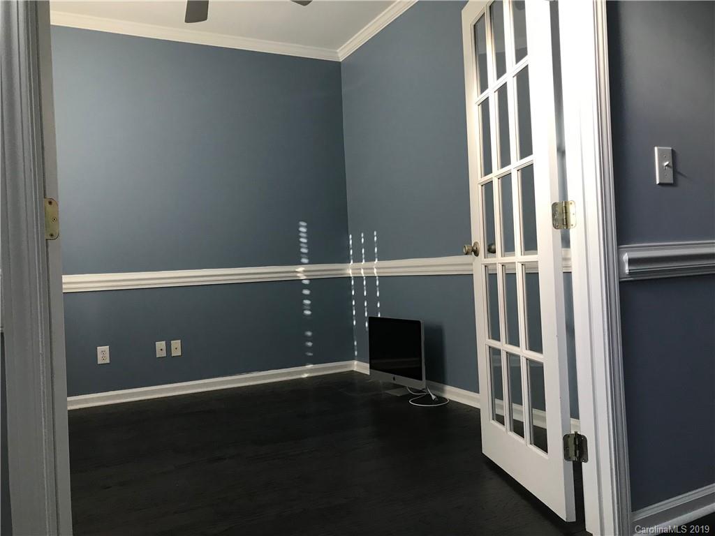 609 Eaton Court Fort Mill, SC 29708 - Photo 7 of 24 an empty room with wooden floor and windows