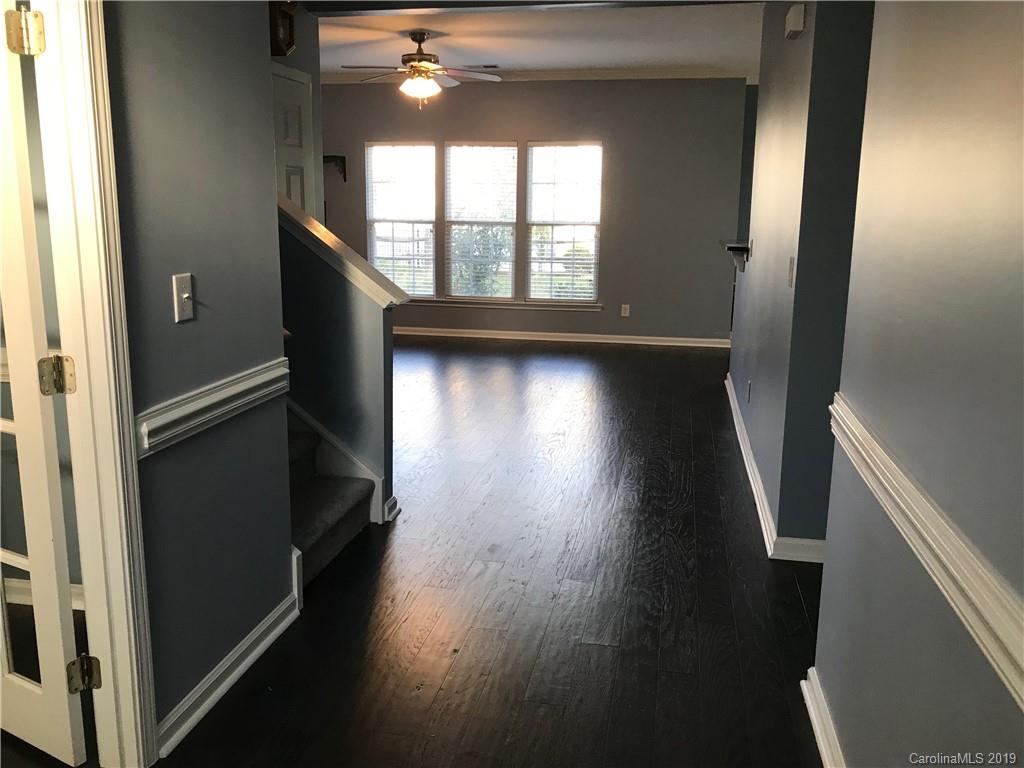 609 Eaton Court Fort Mill, SC 29708 - Photo 8 of 24 a view of empty room with wooden floor and fan