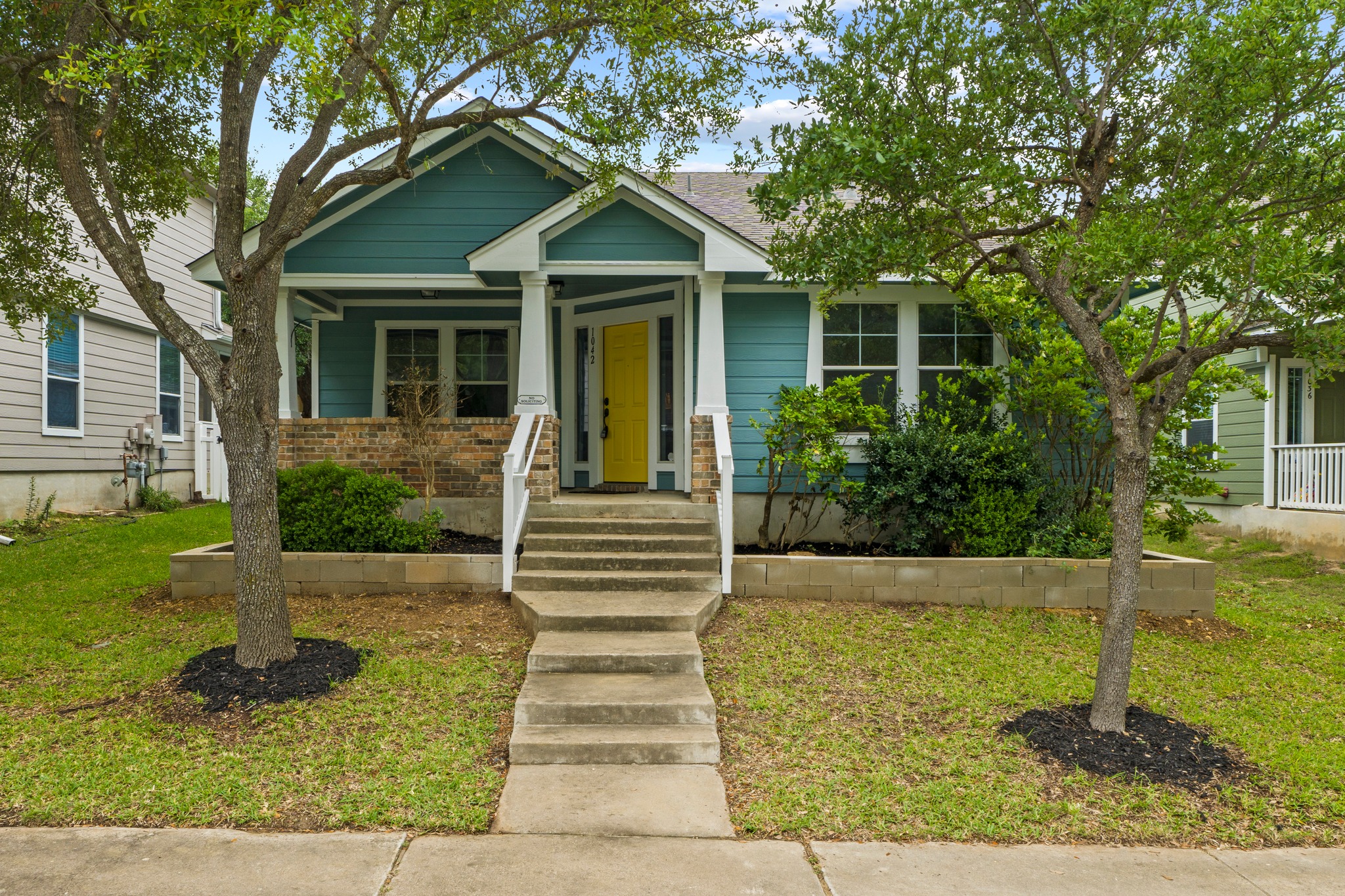 1042 Monadale Trail Round Rock, TX 78664 - Photo 1 of 40 a front view of a house with garden