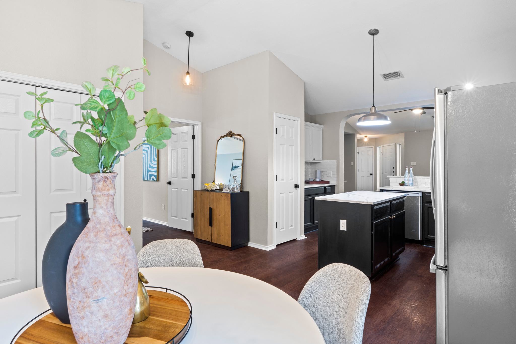1042 Monadale Trail Round Rock, TX 78664 - Photo 12 of 40 a view of living room filled with furniture and a chandelier