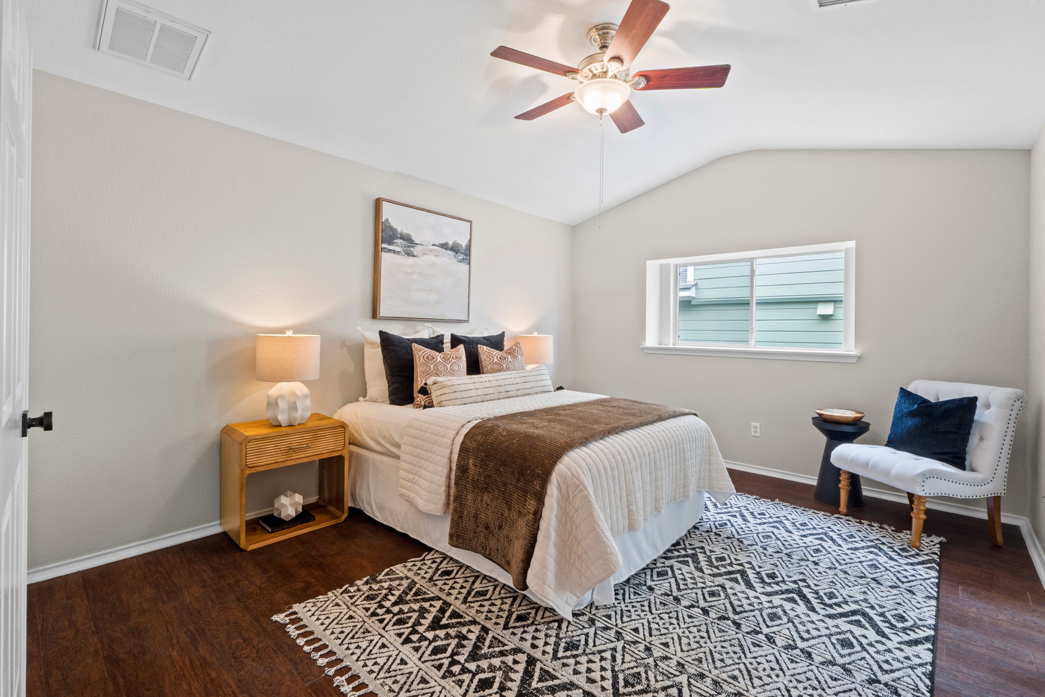 1042 Monadale Trail Round Rock, TX 78664 - Photo 16 of 40 a bedroom with a bed and a chair