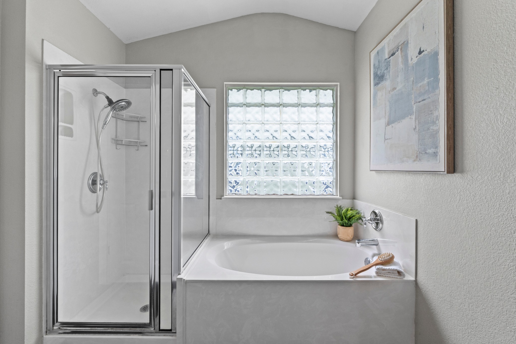 1042 Monadale Trail Round Rock, TX 78664 - Photo 17 of 40 a bath tub sitting in a bathroom next to a window