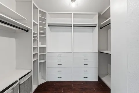 a view of an empty walk in closet