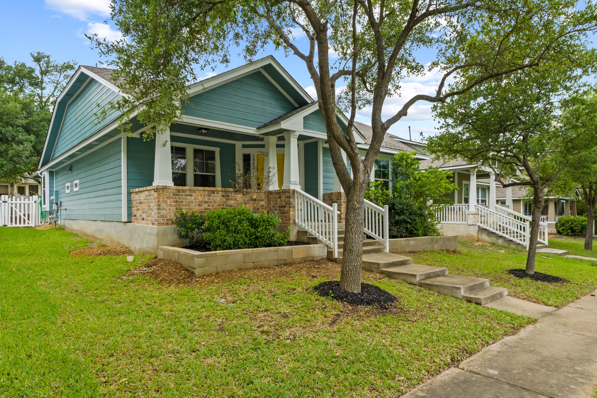 1042 Monadale Trail Round Rock, TX 78664 - Photo 3 of 40 a front view of a house with garden