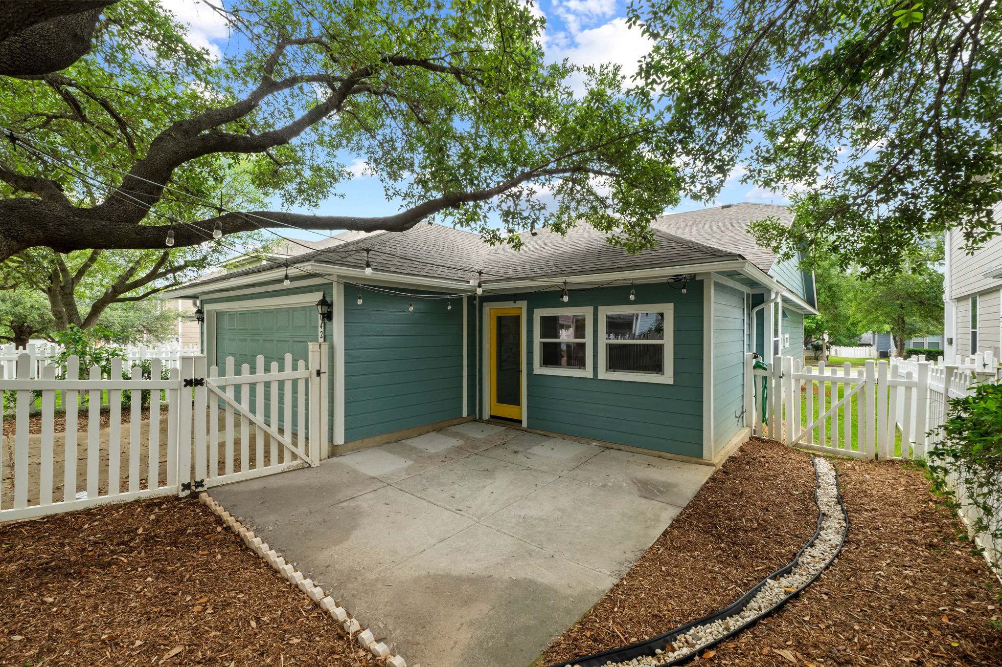 1042 Monadale Trail Round Rock, TX 78664 - Photo 31 of 40 a front view of a house with a garden