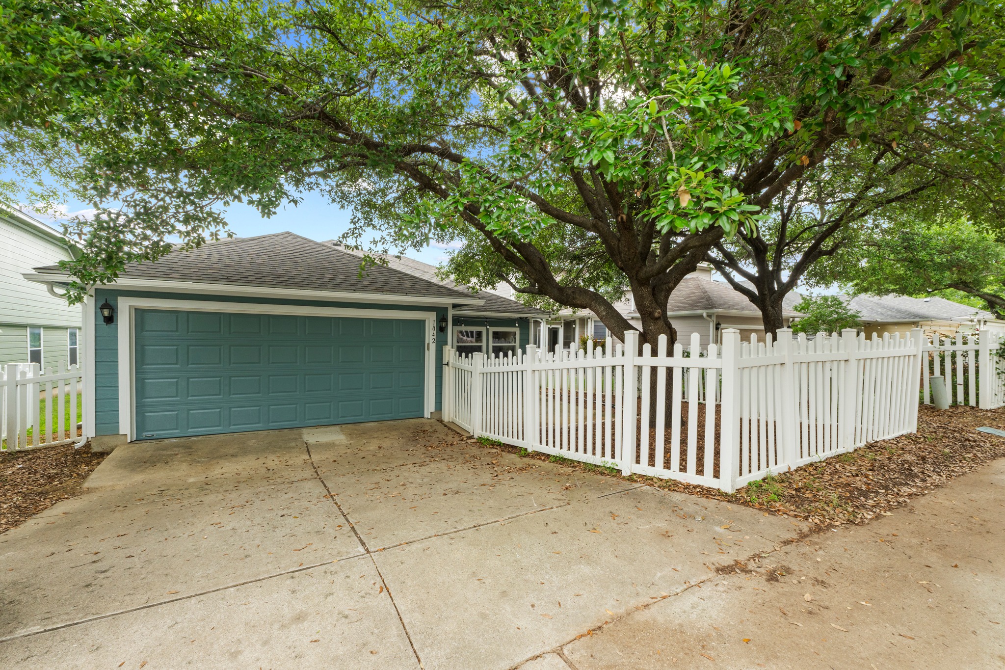 1042 Monadale Trail Round Rock, TX 78664 - Photo 32 of 40 a front view of a house with a garage