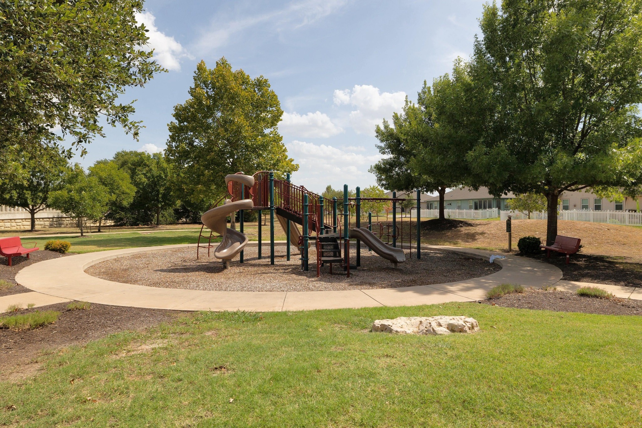 1042 Monadale Trail Round Rock, TX 78664 - Photo 37 of 40 a view of a park with swings and slides