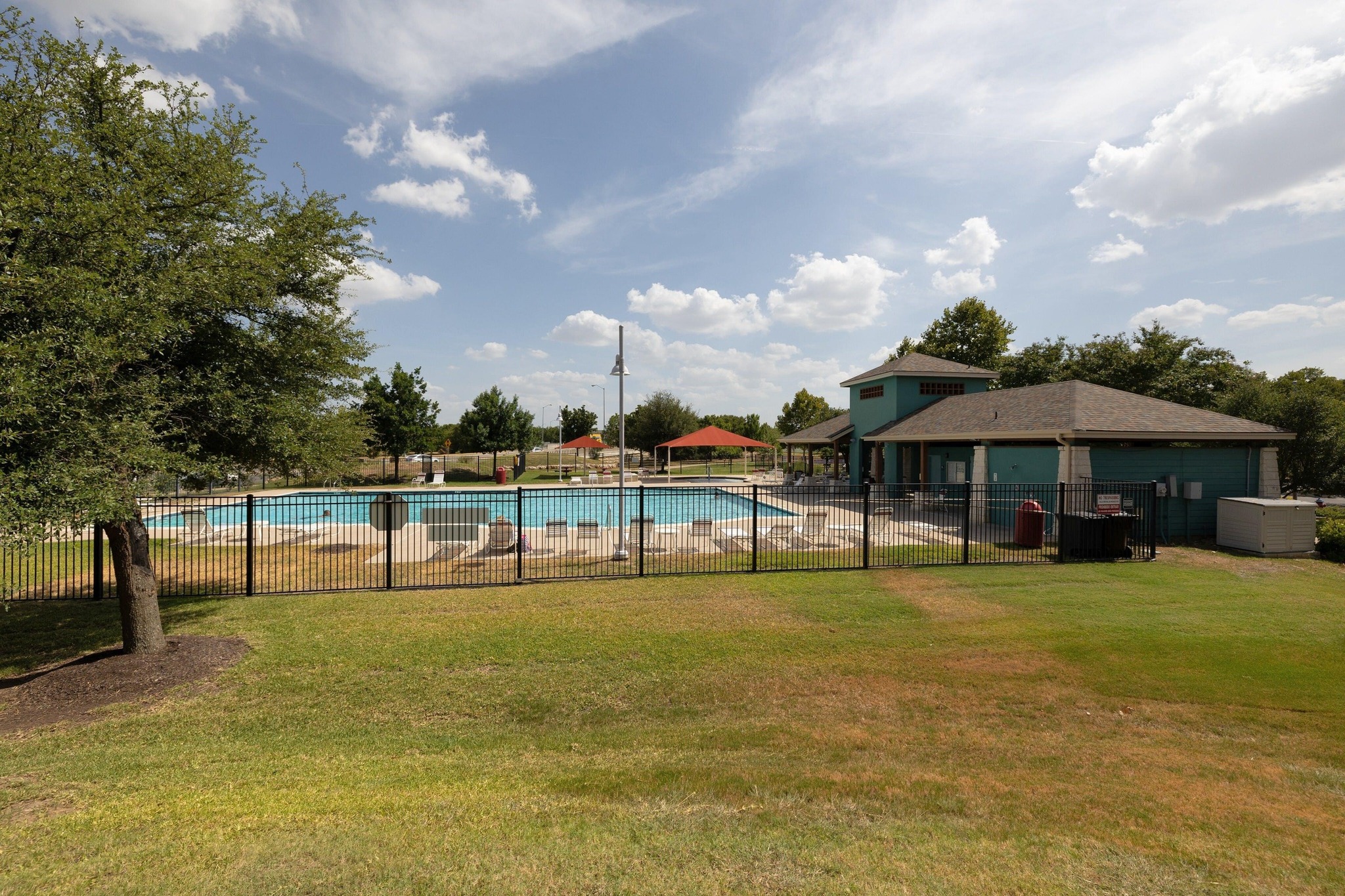 1042 Monadale Trail Round Rock, TX 78664 - Photo 40 of 40 a view of a swimming pool with a table and chairs