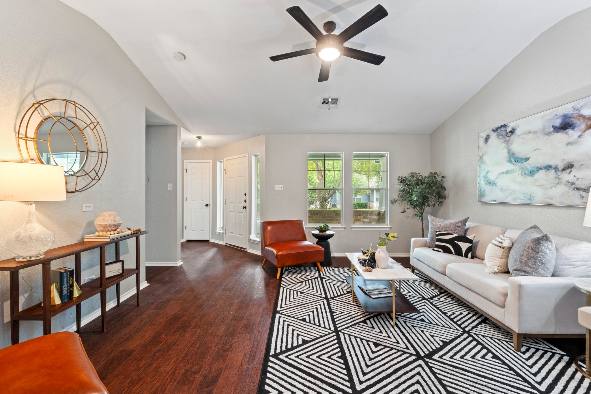 1042 Monadale Trail Round Rock, TX 78664 - Photo 6 of 40 a living room with furniture a rug and a window