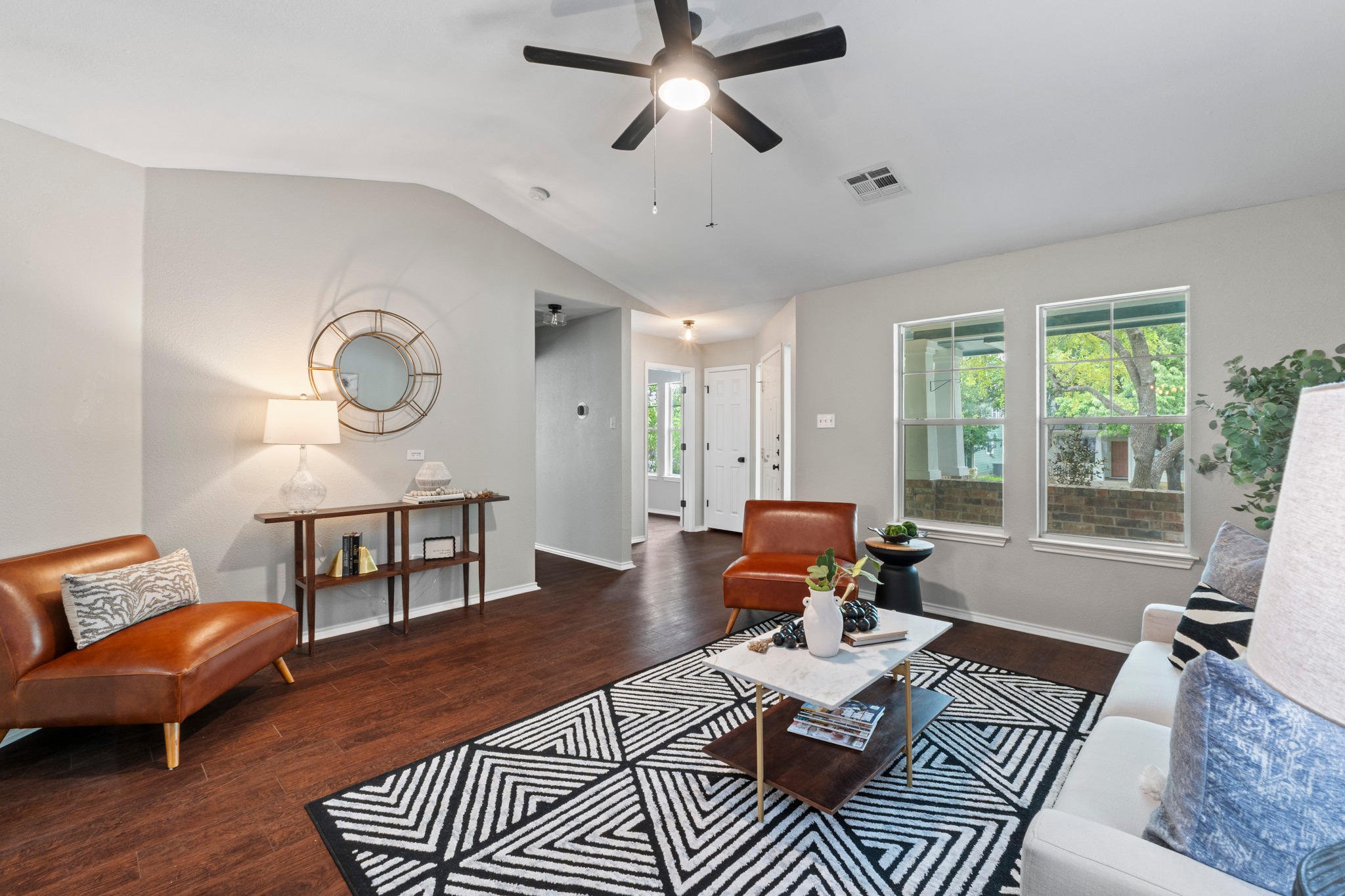 1042 Monadale Trail Round Rock, TX 78664 - Photo 10 of 40 a living room with furniture a rug and a large window