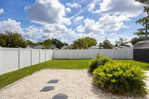 a backyard of a house with lots of green space