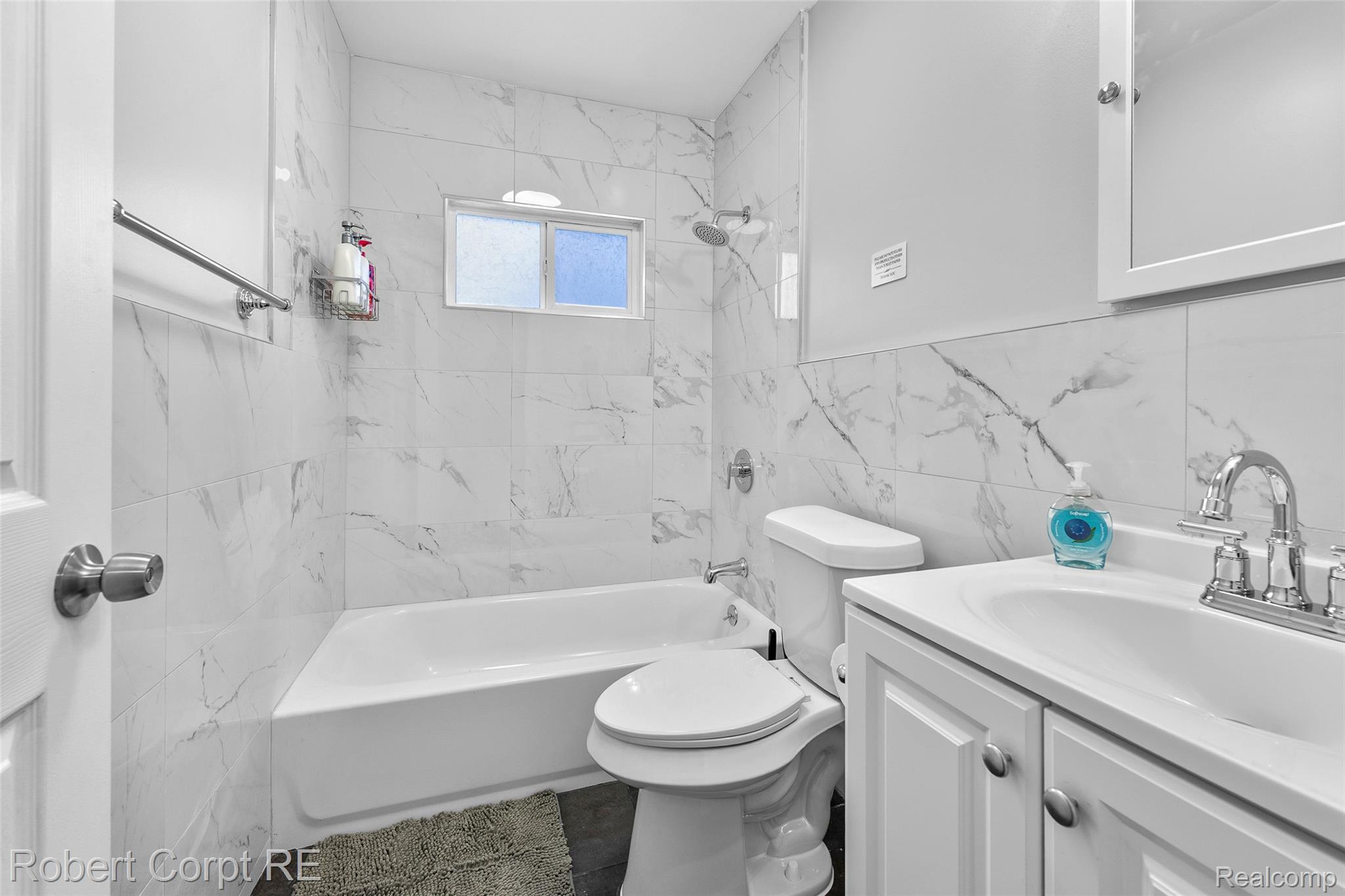 4772 Harding Street Dearborn Heights, MI 48125 - Photo 7 of 22 Full bathroom with vanity, shower / tub combination, and tile walls