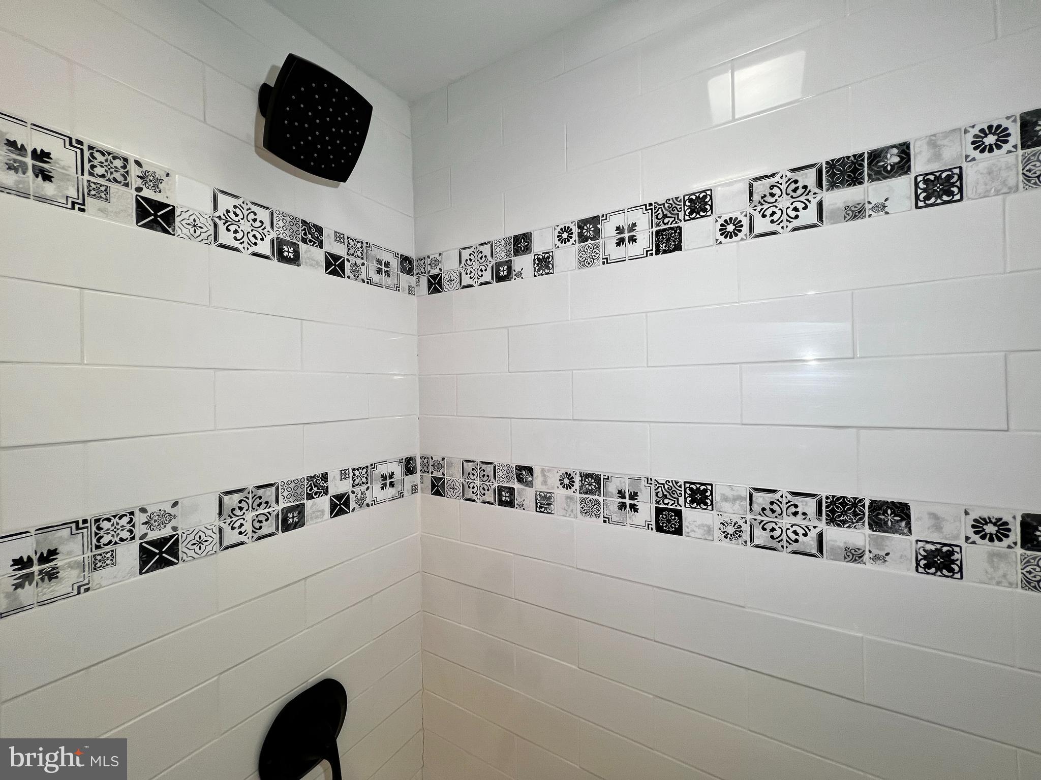 516 10th Avenue Lindenwold, NJ 08021 - Photo 11 of 22 a bathroom with a bathtub and a shower