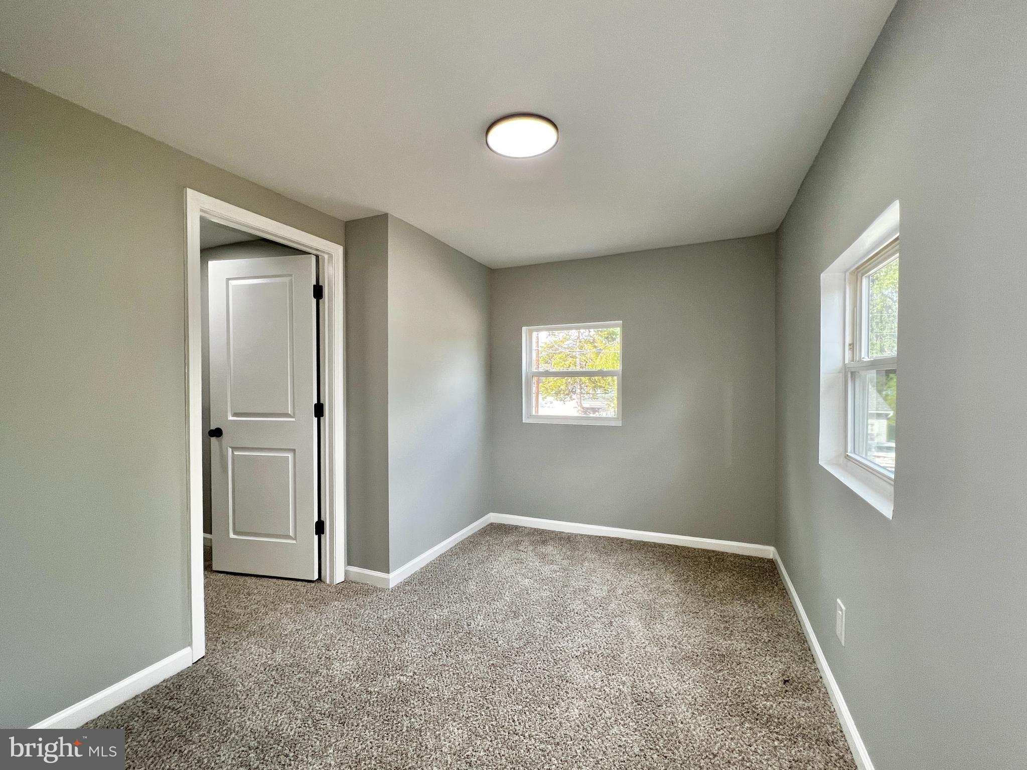 516 10th Avenue Lindenwold, NJ 08021 - Photo 14 of 22 a view of an empty room and window