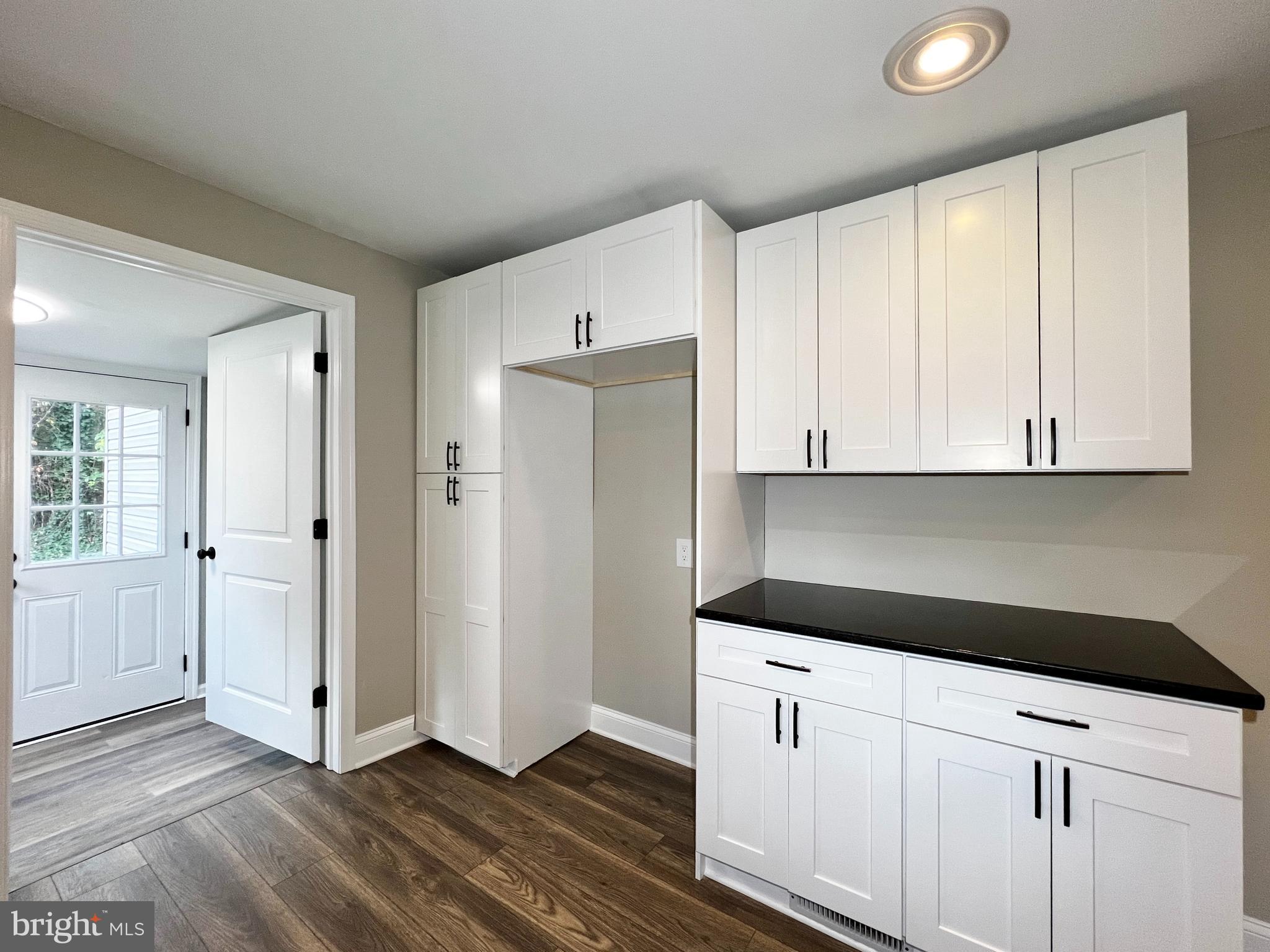 516 10th Avenue Lindenwold, NJ 08021 - Photo 7 of 22 a kitchen with white cabinets and white appliances