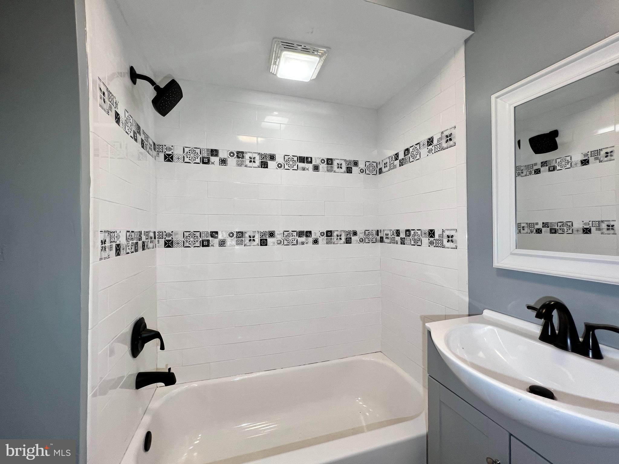516 10th Avenue Lindenwold, NJ 08021 - Photo 10 of 22 a bathroom with a sink a toilet and a bathtub