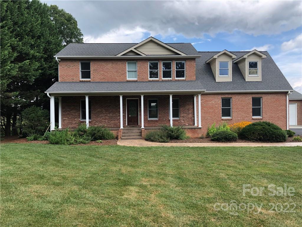 624 Butler Bridge Road Fletcher, NC 28732 - Photo 1 of 33 a front view of a house with a yard