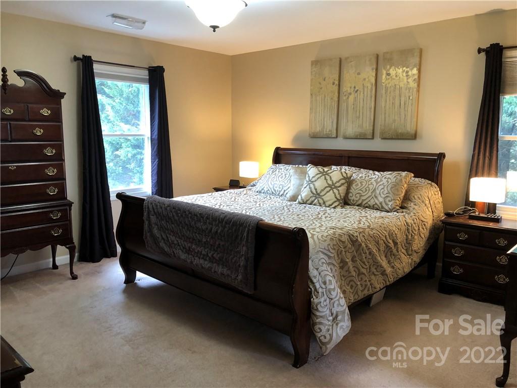 624 Butler Bridge Road Fletcher, NC 28732 - Photo 25 of 33 a bedroom with a bed and a dresser