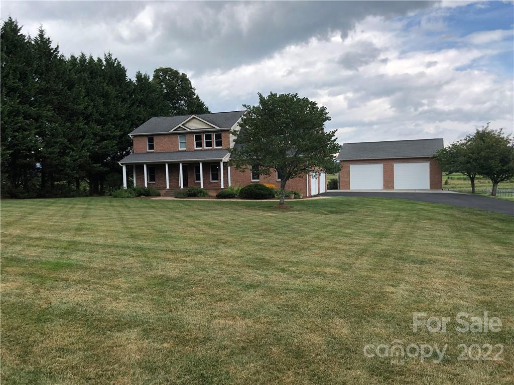 624 Butler Bridge Road Fletcher, NC 28732 - Photo 3 of 33 a front view of a house with a garden