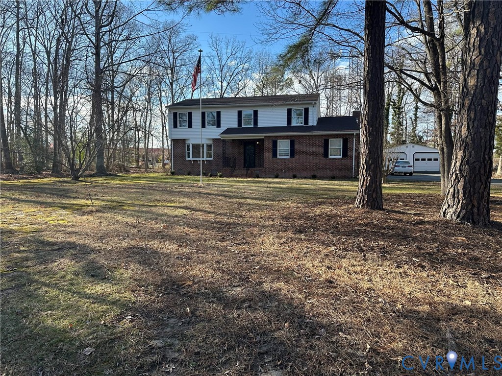 a view of a house with a yard