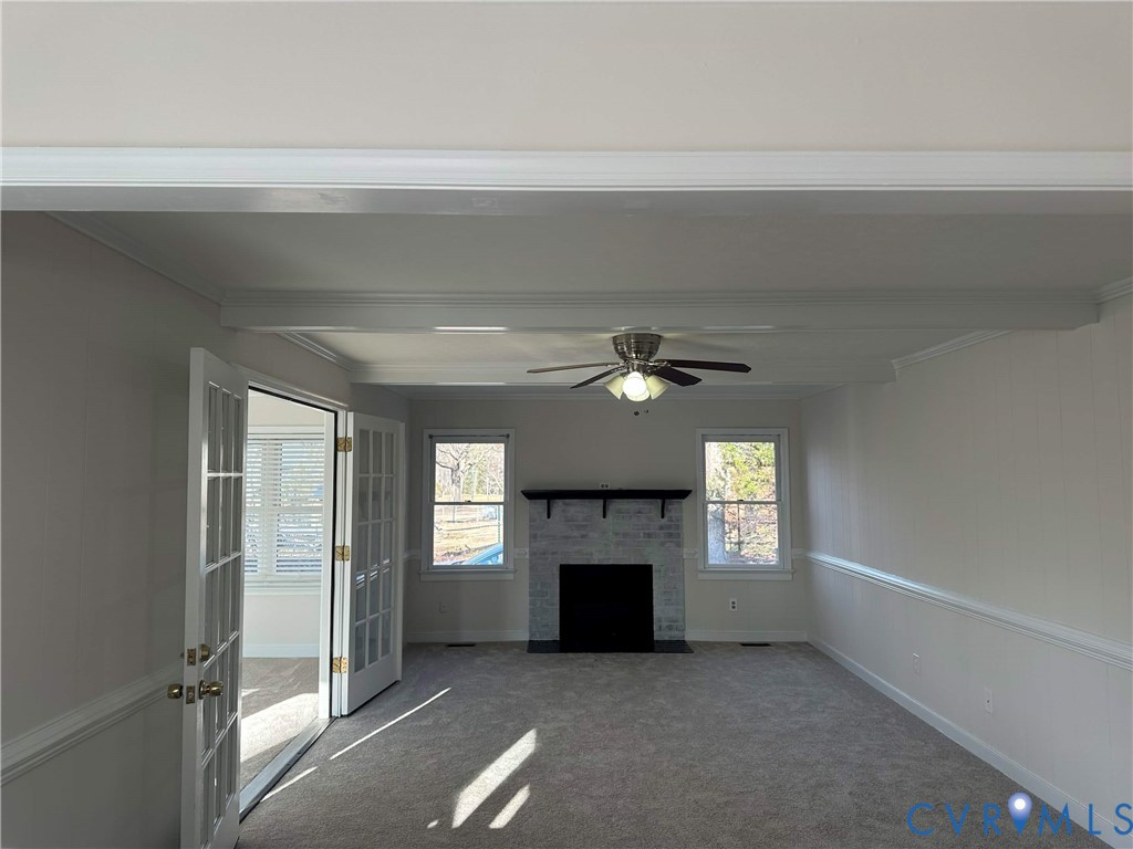 10510 Courtney Road Glen Allen, VA 23060 - Photo 12 of 32 a view of an empty room with a fireplace and a window