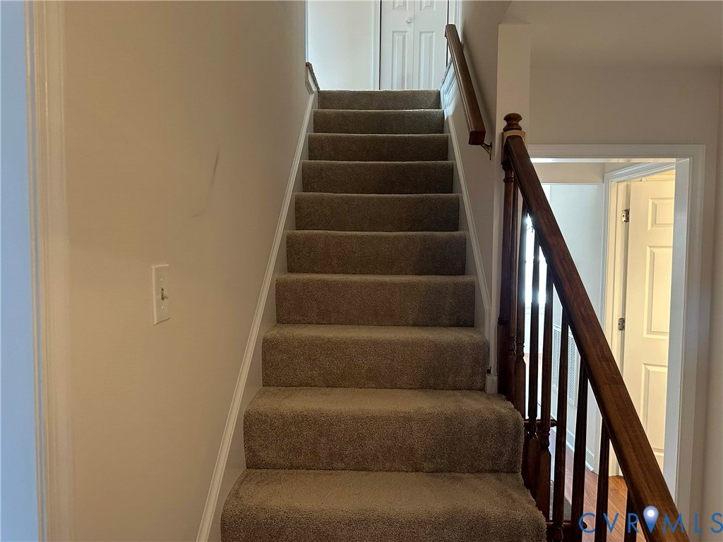 10510 Courtney Road Glen Allen, VA 23060 - Photo 22 of 32 a view of staircase with wooden floor and white walls