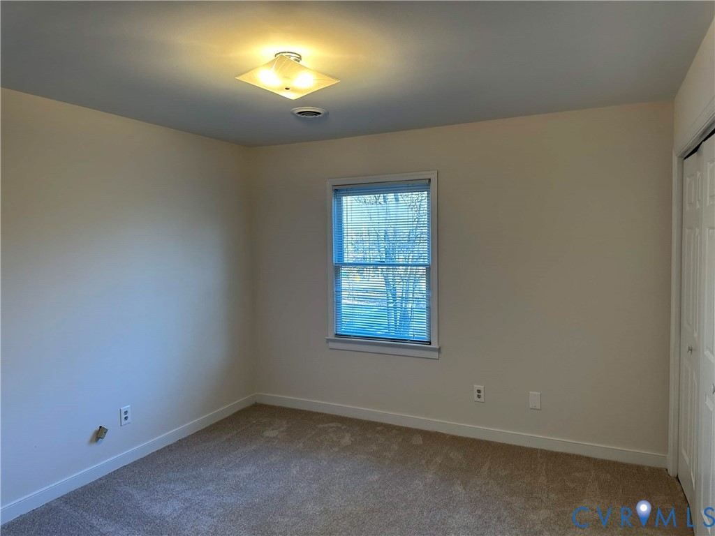 10510 Courtney Road Glen Allen, VA 23060 - Photo 28 of 32 an empty room with a window