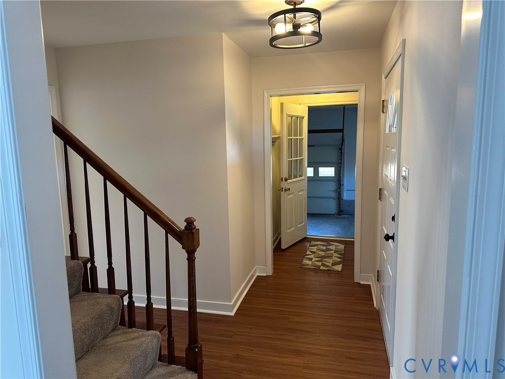 10510 Courtney Road Glen Allen, VA 23060 - Photo 3 of 32 a view of a hallway with wooden floor and staircase