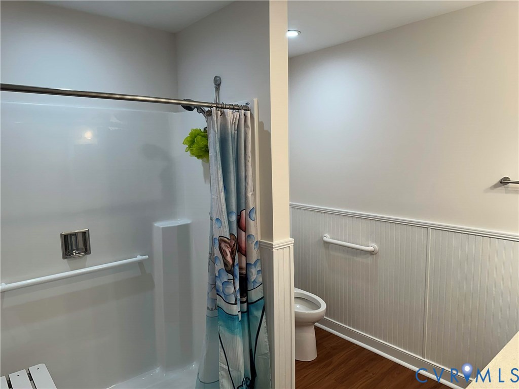 10510 Courtney Road Glen Allen, VA 23060 - Photo 10 of 32 a bathroom with a shower and a glass door