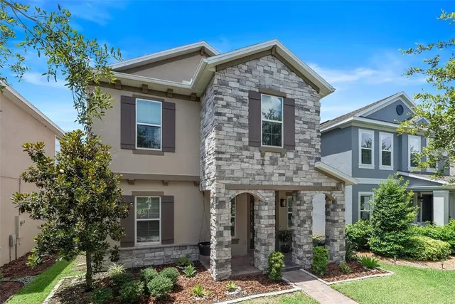 a front view of a house with garden