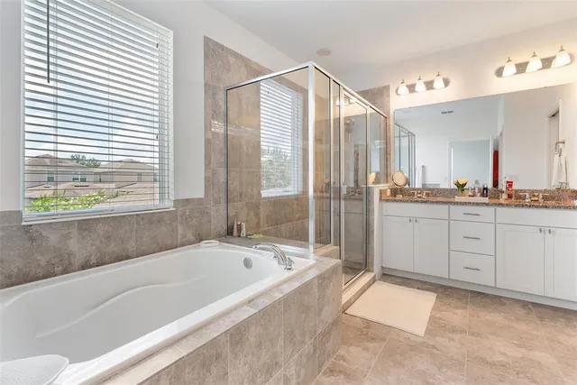 a white toilet sitting next to a white wall