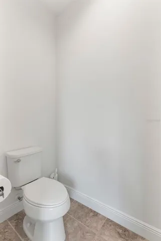 a view of walk in closet with clothes