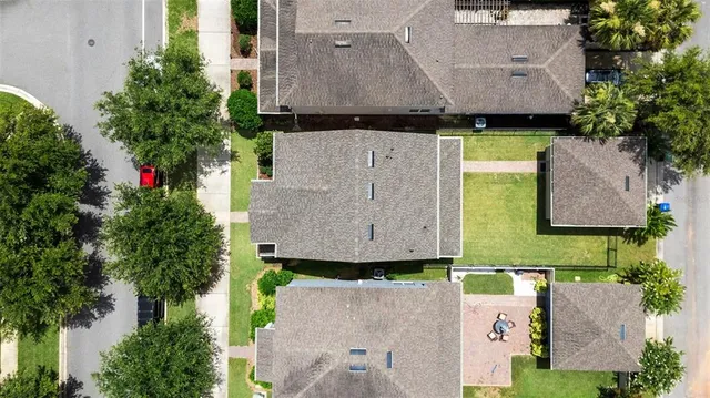 an aerial view of a house with a garden