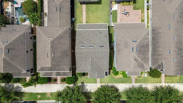 aerial view of a house with a yard and plants