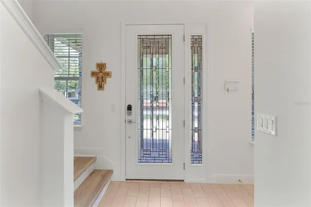 a view of an entryway with wooden floor