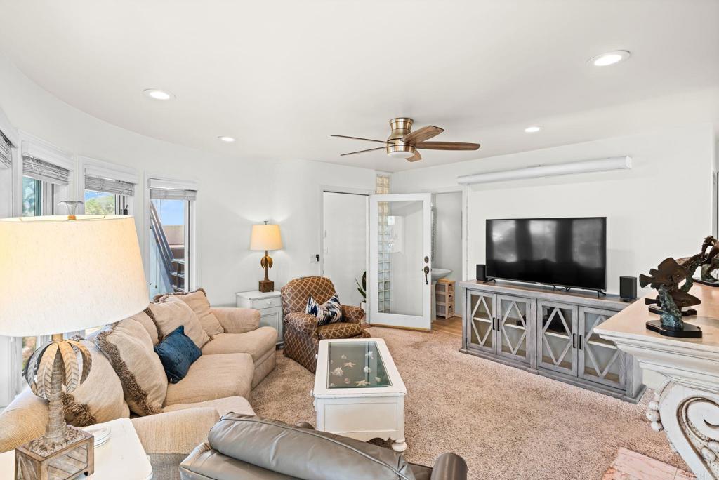 1105 Reed Avenue San Diego, CA 92109 - Photo 12 of 35 a living room with furniture and a flat screen tv