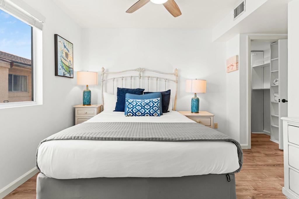 1105 Reed Avenue San Diego, CA 92109 - Photo 8 of 35 a large bed sitting in a bedroom next to a window