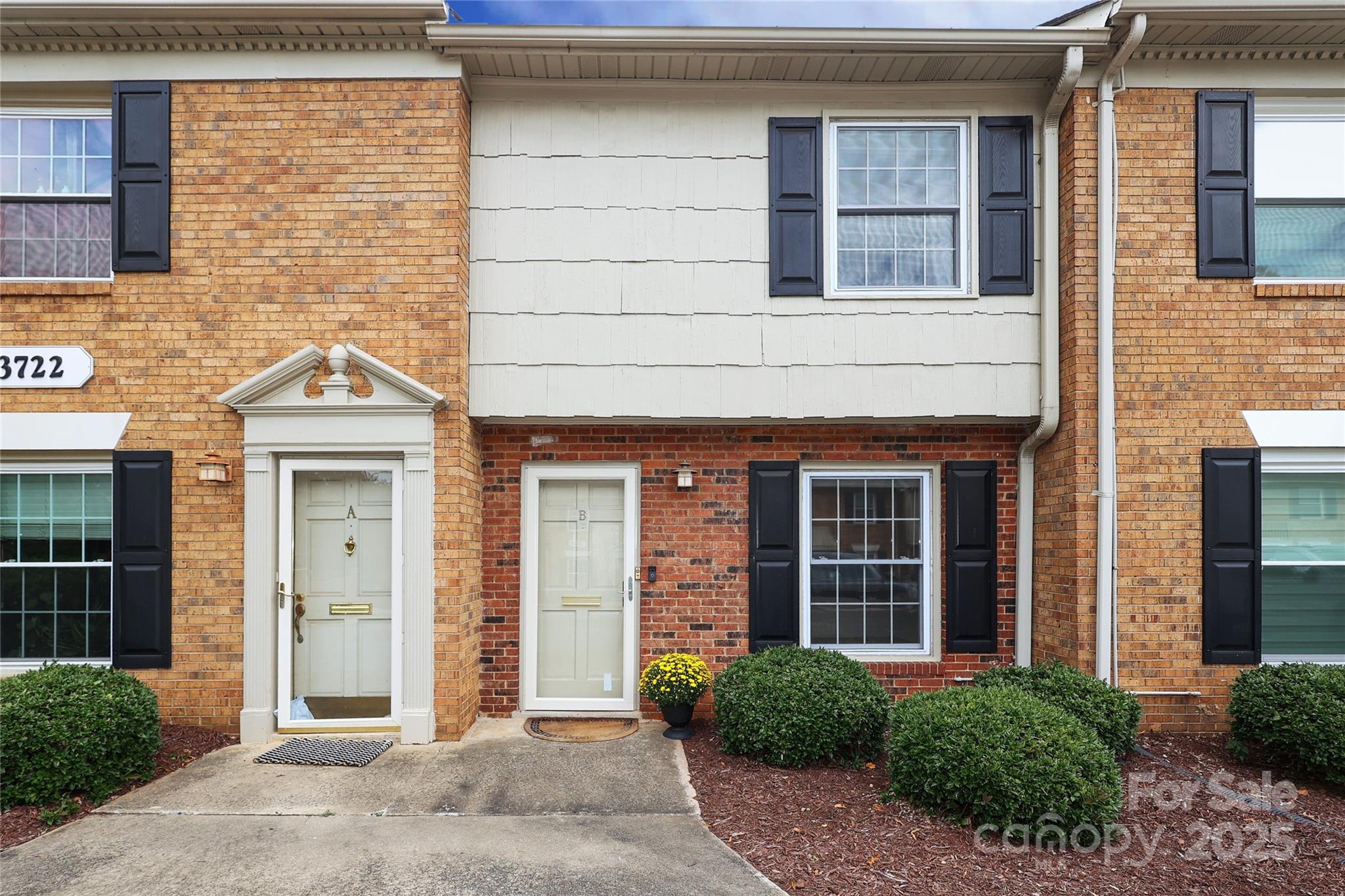 3722 Park Road, Unit B Charlotte, NC 28209 - Photo 2 of 48 a view of a brick house with a large windows and a large window