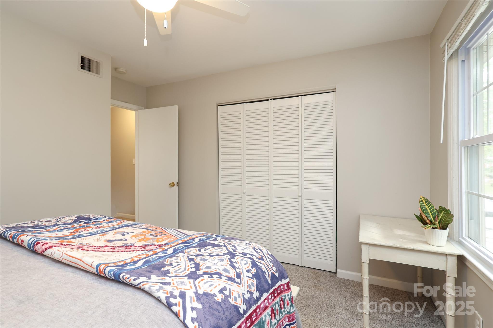 3722 Park Road, Unit B Charlotte, NC 28209 - Photo 22 of 48 a bedroom with a bed and a table in it