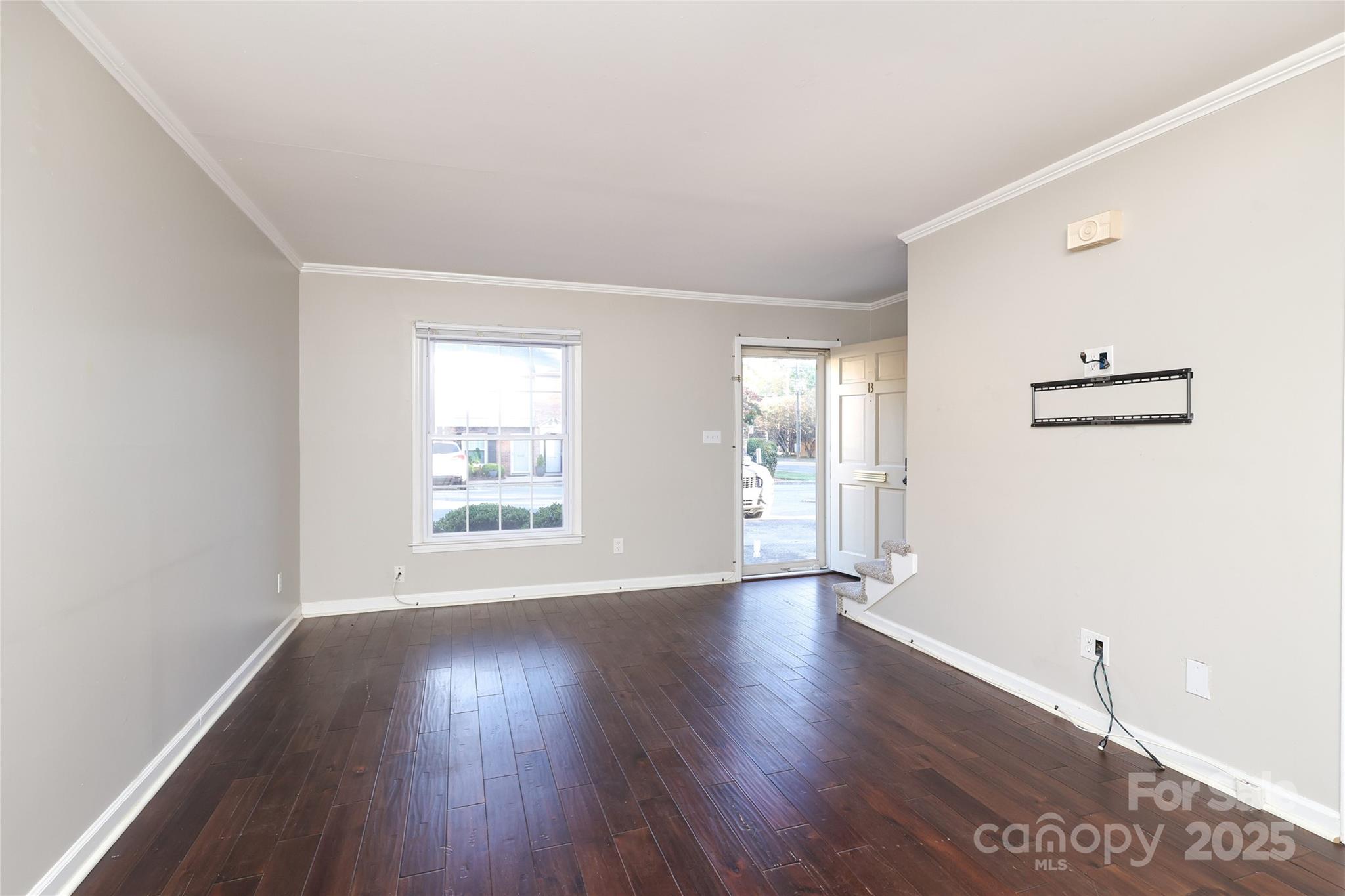 3722 Park Road, Unit B Charlotte, NC 28209 - Photo 27 of 48 a view of an empty room with wooden floor and a window