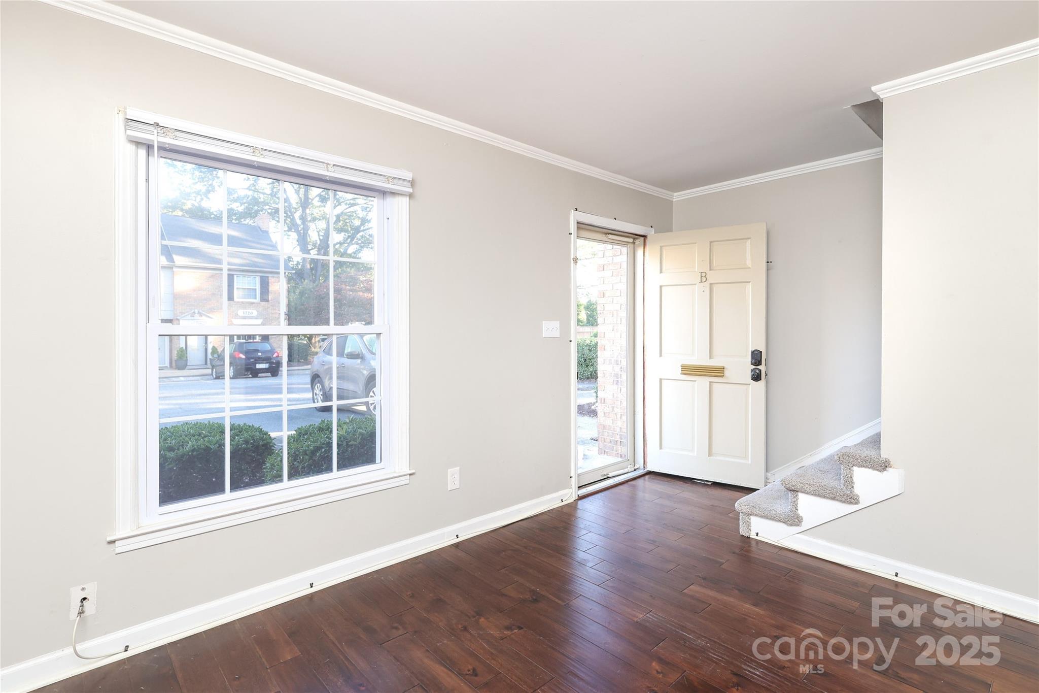 3722 Park Road, Unit B Charlotte, NC 28209 - Photo 28 of 48 an empty room with wooden floor and windows