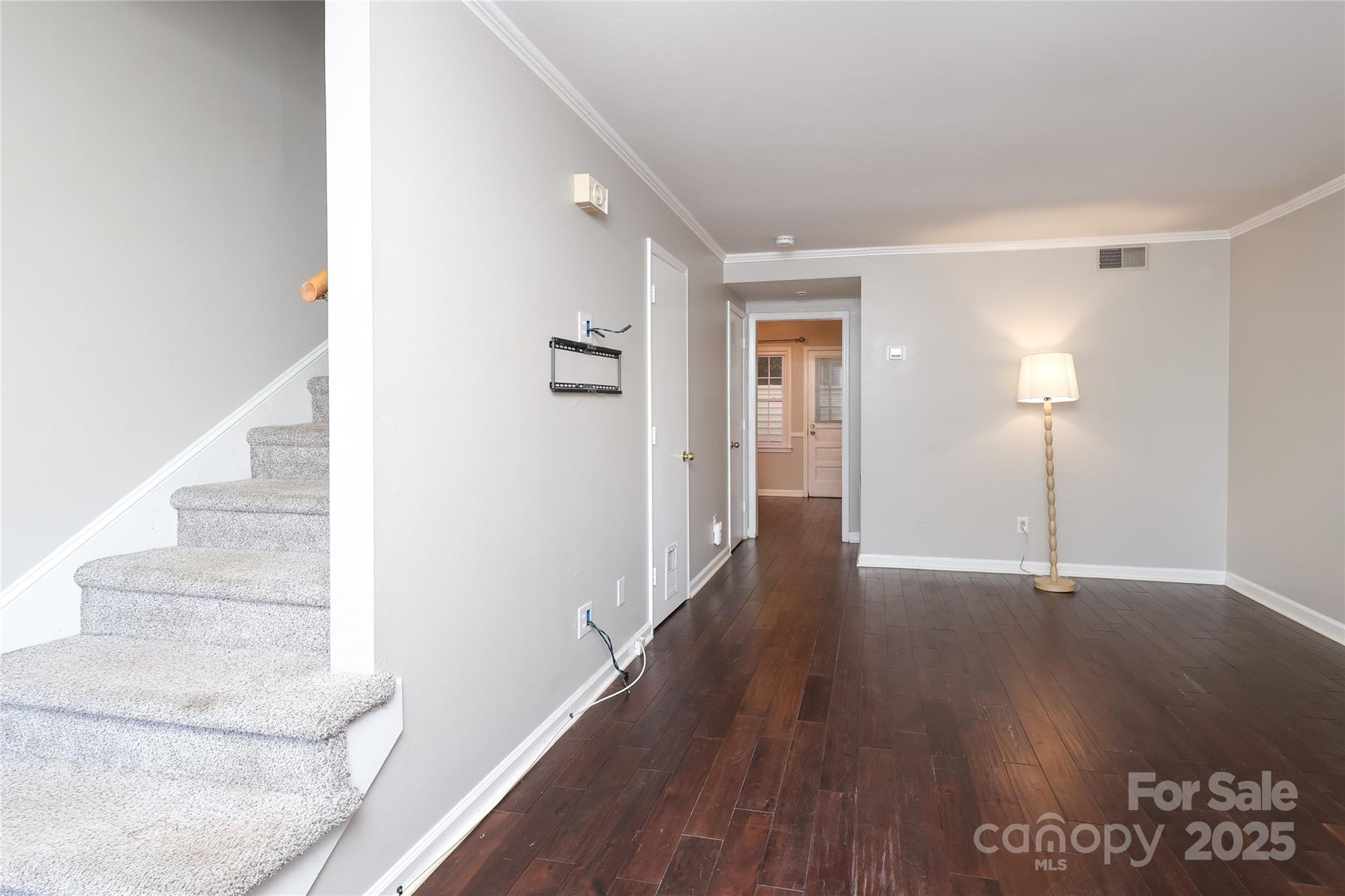 3722 Park Road, Unit B Charlotte, NC 28209 - Photo 29 of 48 a view of an empty room with wooden floor and stairs