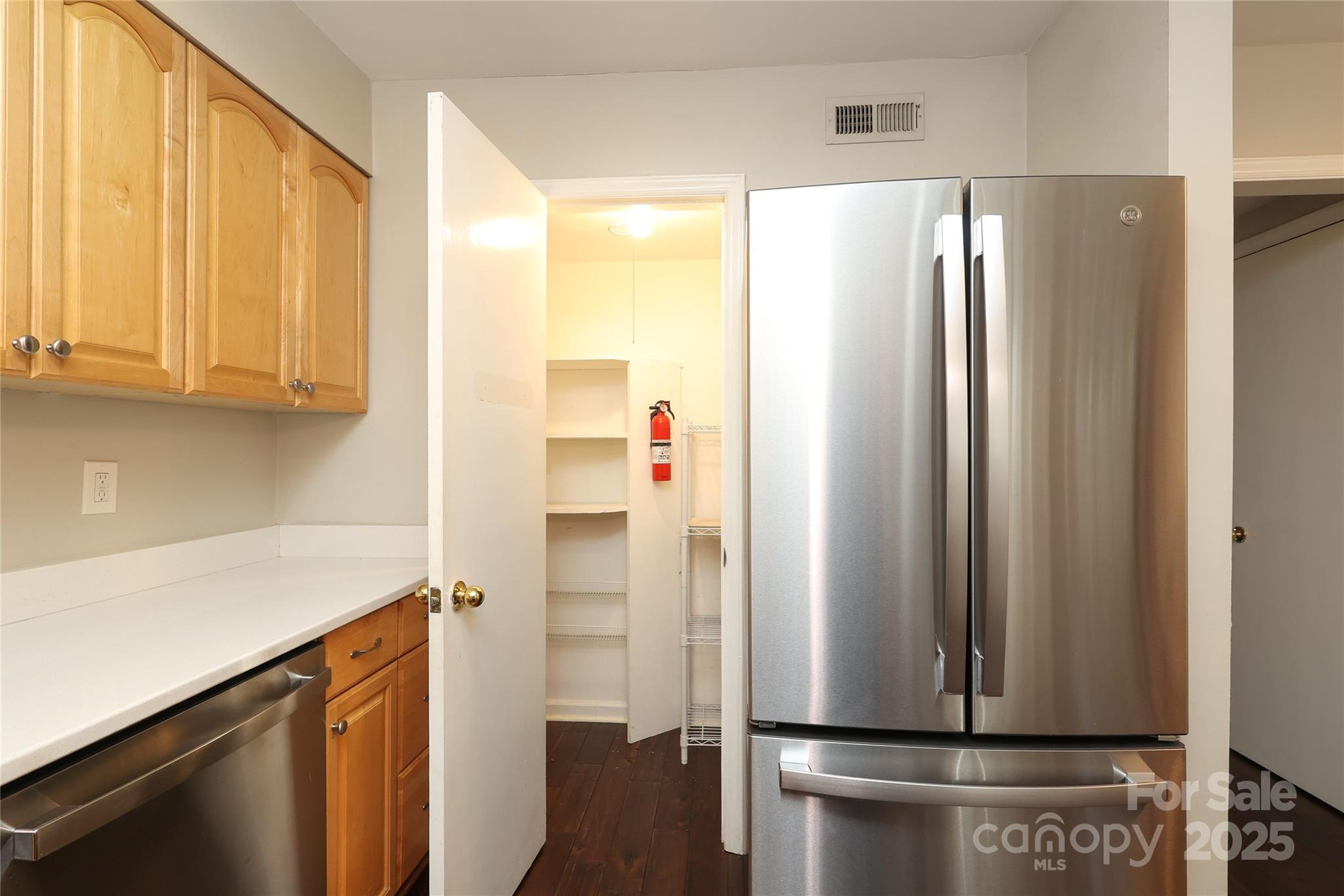 3722 Park Road, Unit B Charlotte, NC 28209 - Photo 36 of 48 a room with stainless steel appliances a refrigerator and cabinets
