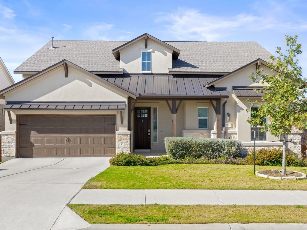 5912 Cimarron Rdg Lane Austin, TX 78738 - Photo 1 of 1 View of front of house featuring a standing seam roof, stone siding, a metal roof, and a porch