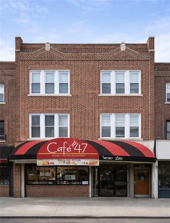 a cafe on the corner of a building