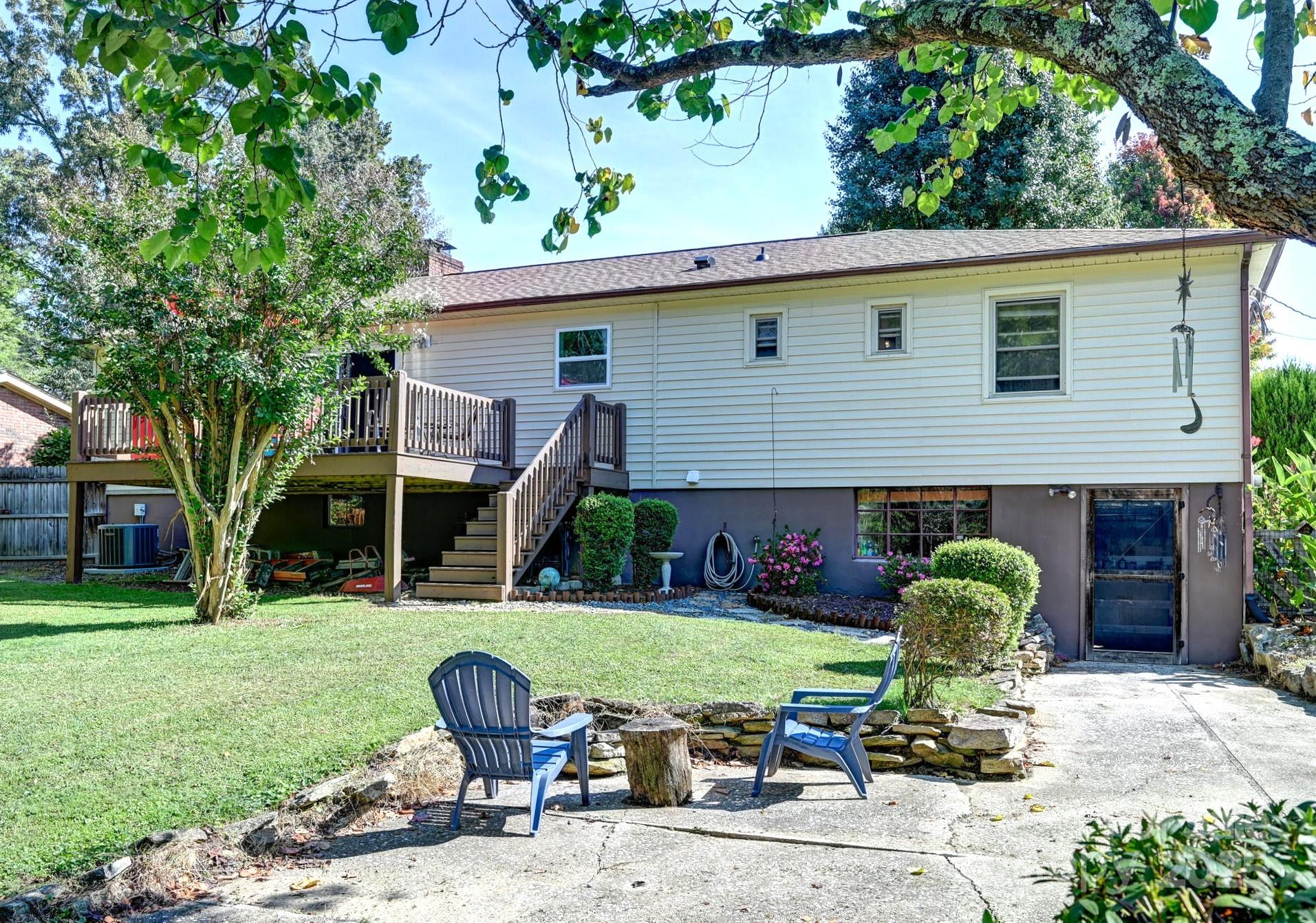 402 Balsam Road Hendersonville, NC 28792 - Photo 26 of 26 a front view of a house with garden and trees