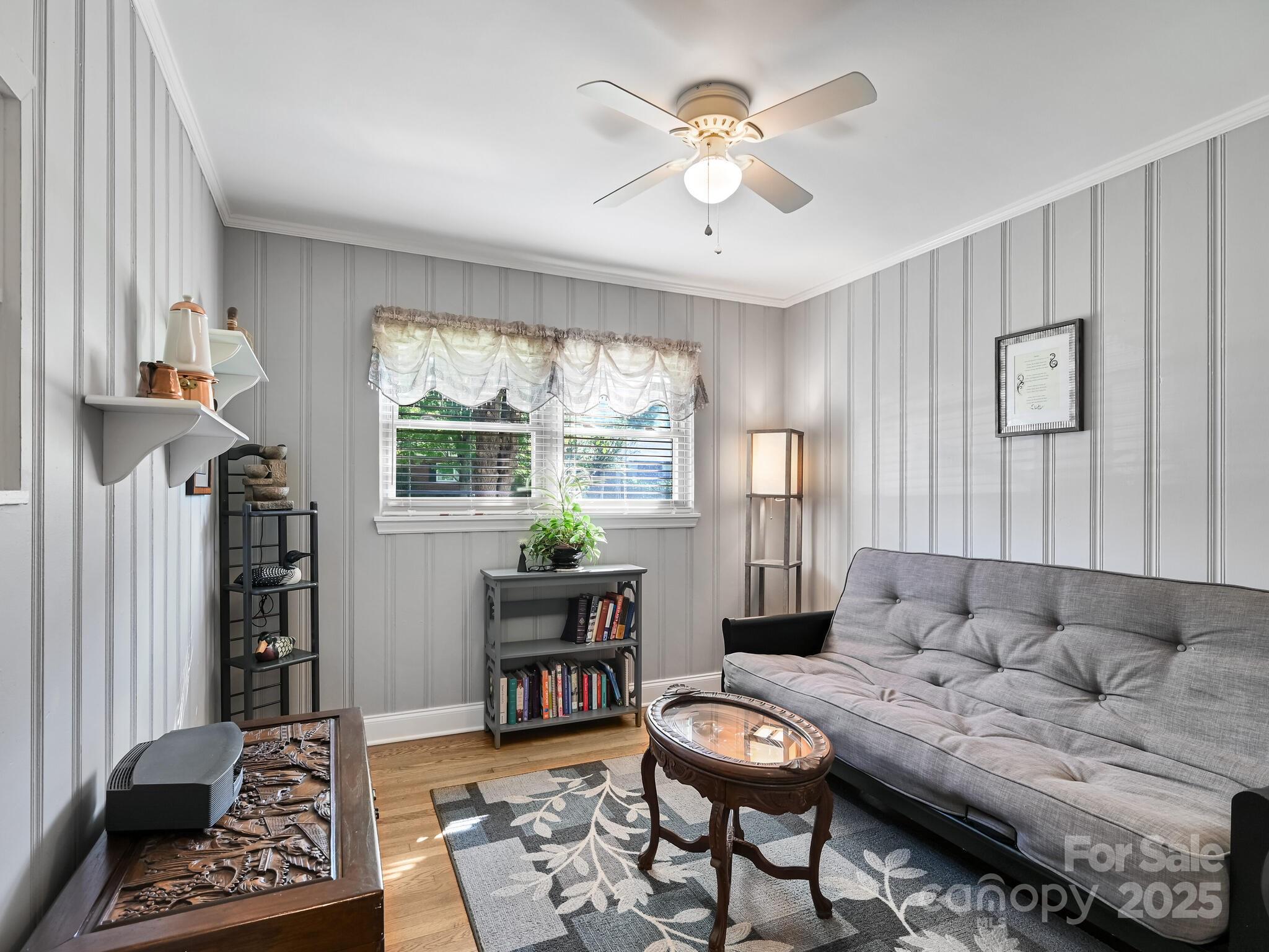 402 Balsam Road Hendersonville, NC 28792 - Photo 9 of 26 a living room with furniture and a window